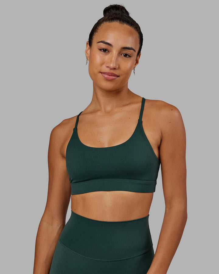 Woman wearing Elixir Sports Bra - Vital Green