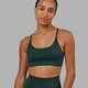 Woman wearing Elixir Sports Bra - Vital Green