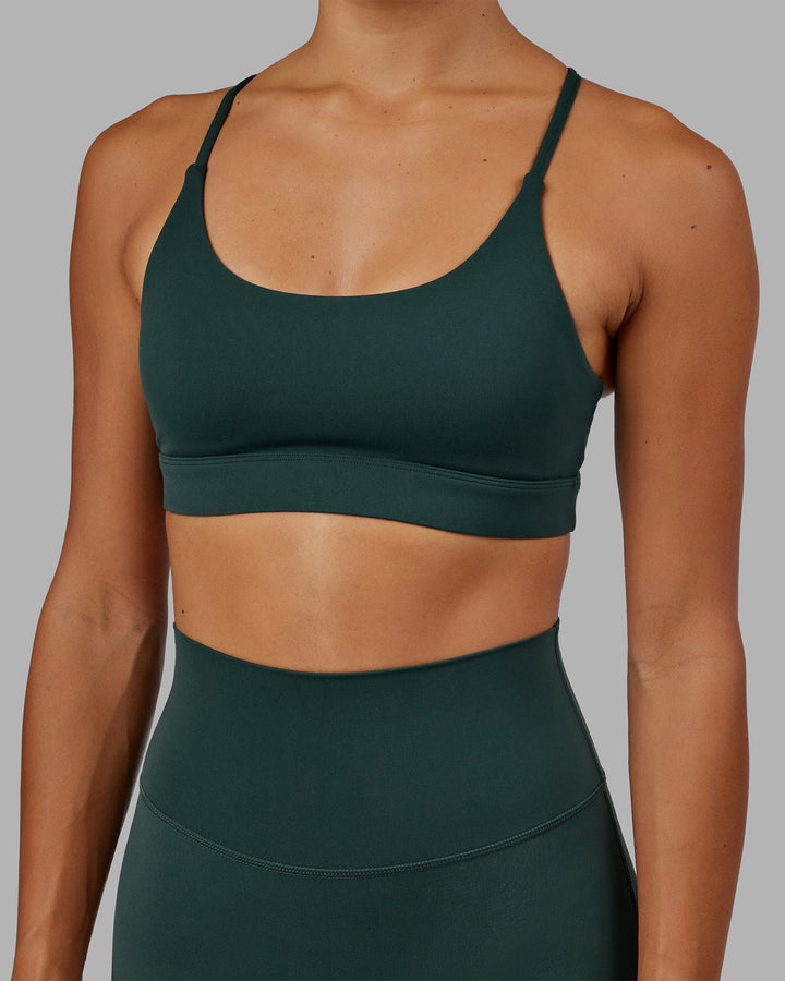 Woman wearing Elixir Sports Bra - Vital Green