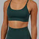 Woman wearing Elixir Sports Bra - Vital Green