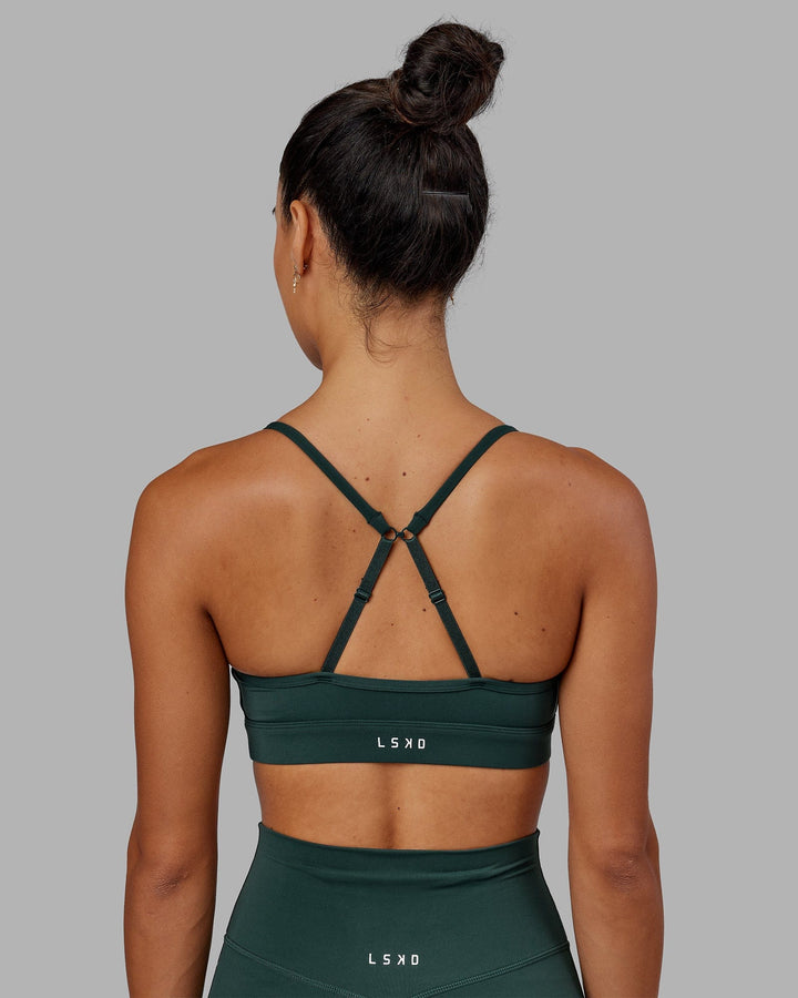 Woman wearing Elixir Sports Bra - Vital Green