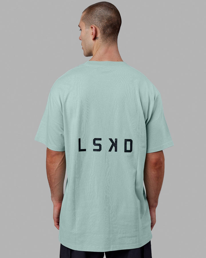 Man wearing Endeavour Heavyweight Long Line Tee Oversize - Pastel Turquoise