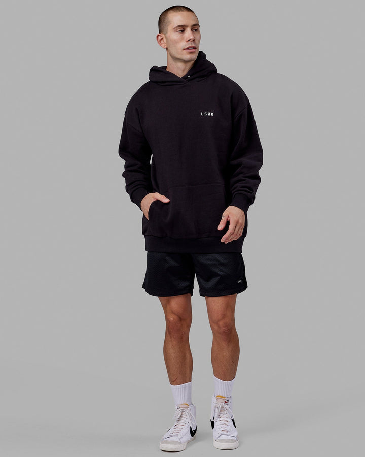 Man wearing Endeavour Longline Hoodie Oversize - Black
