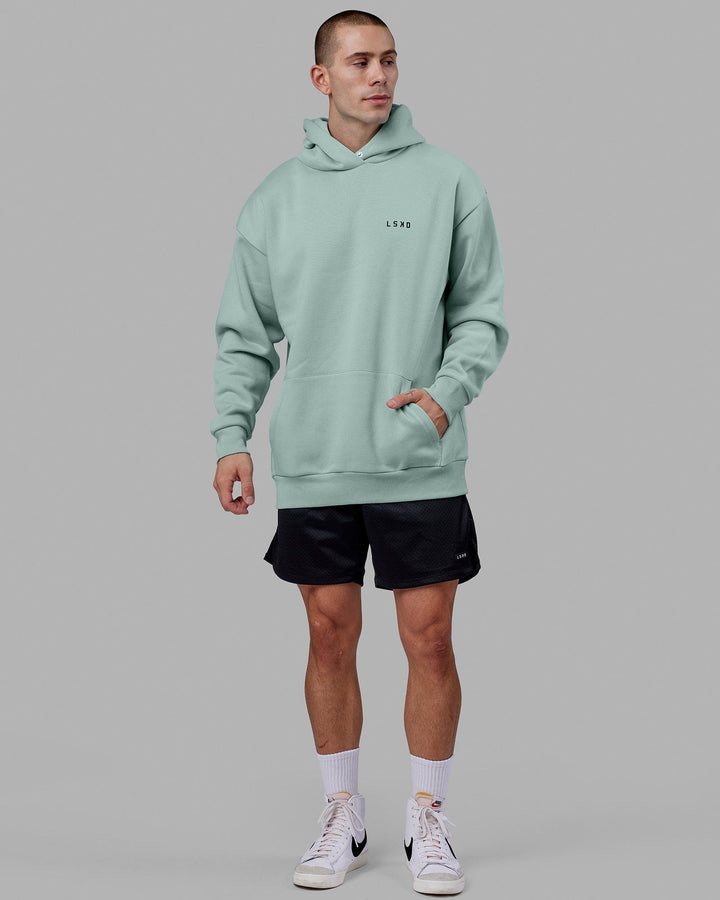 Man wearing Endeavour Longline Hoodie Oversize - Pastel Turquoise