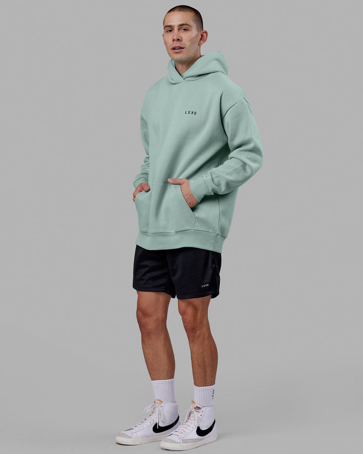 Man wearing Endeavour Longline Hoodie Oversize - Pastel Turquoise