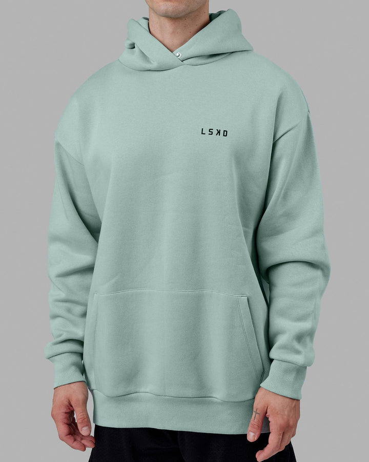 Man wearing Endeavour Longline Hoodie Oversize - Pastel Turquoise
