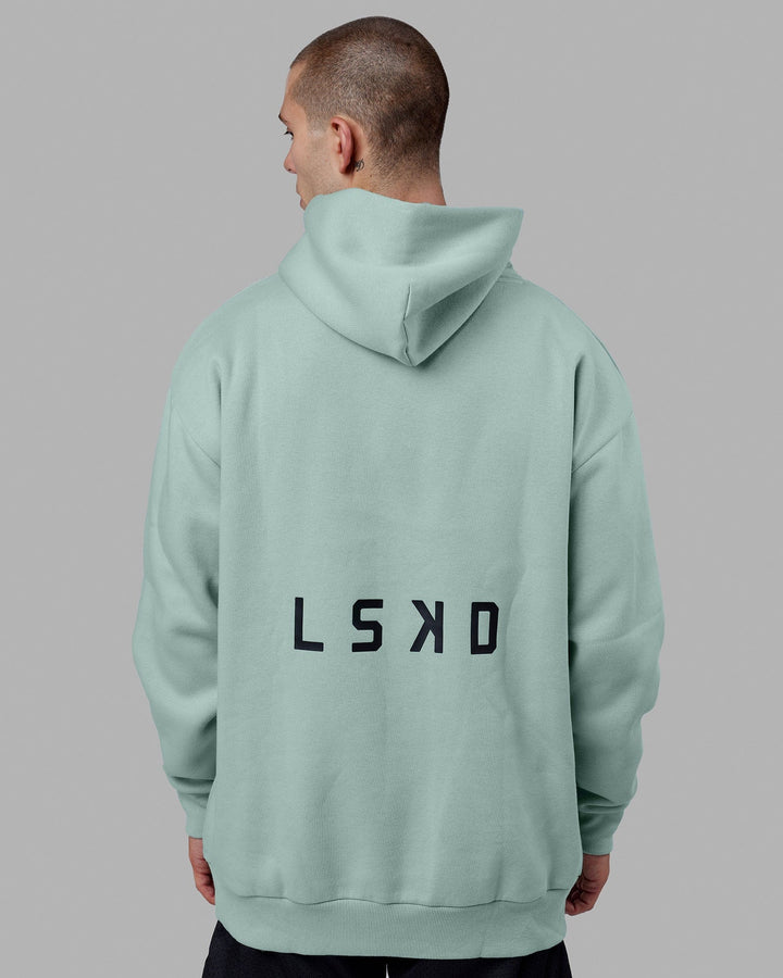 Man wearing Endeavour Longline Hoodie Oversize - Pastel Turquoise