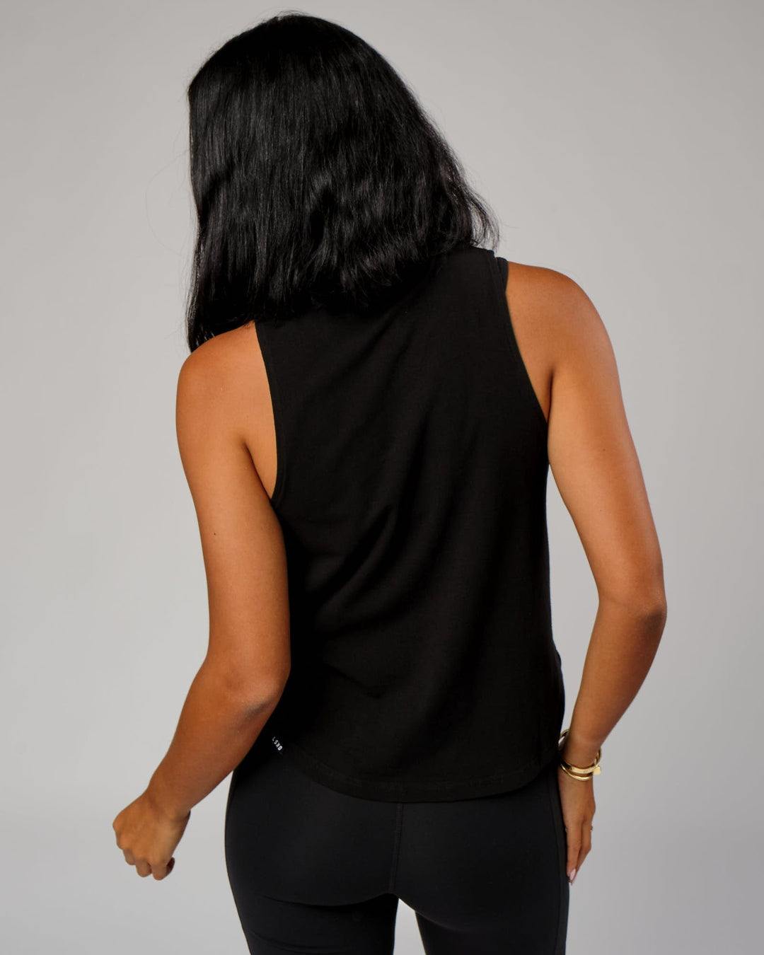 Woman wearing Expand FLXCotton Tank - Black