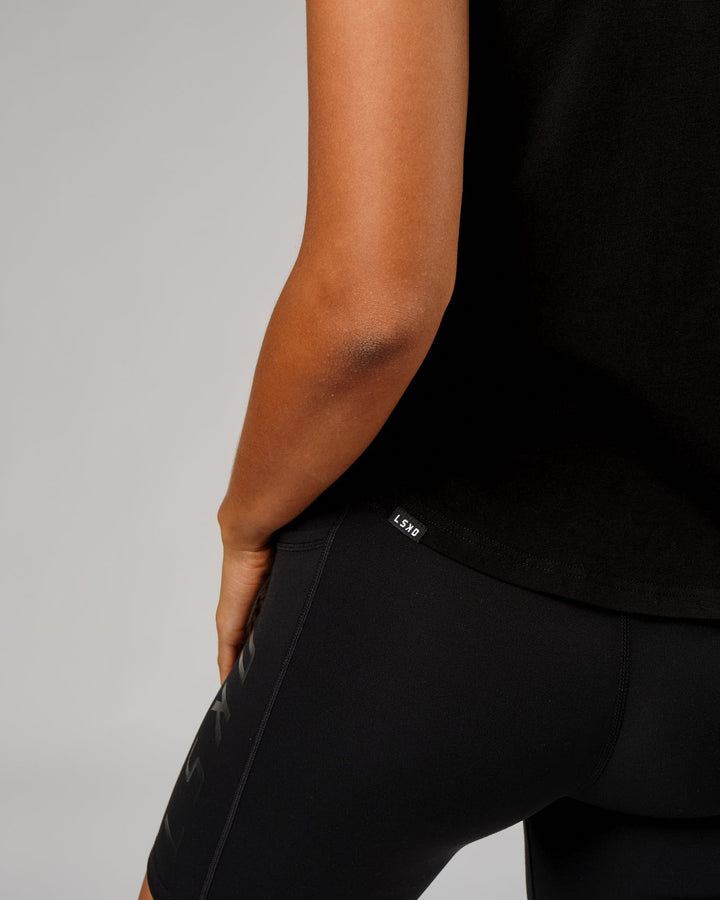 Woman wearing Expand FLXCotton Tank - Black