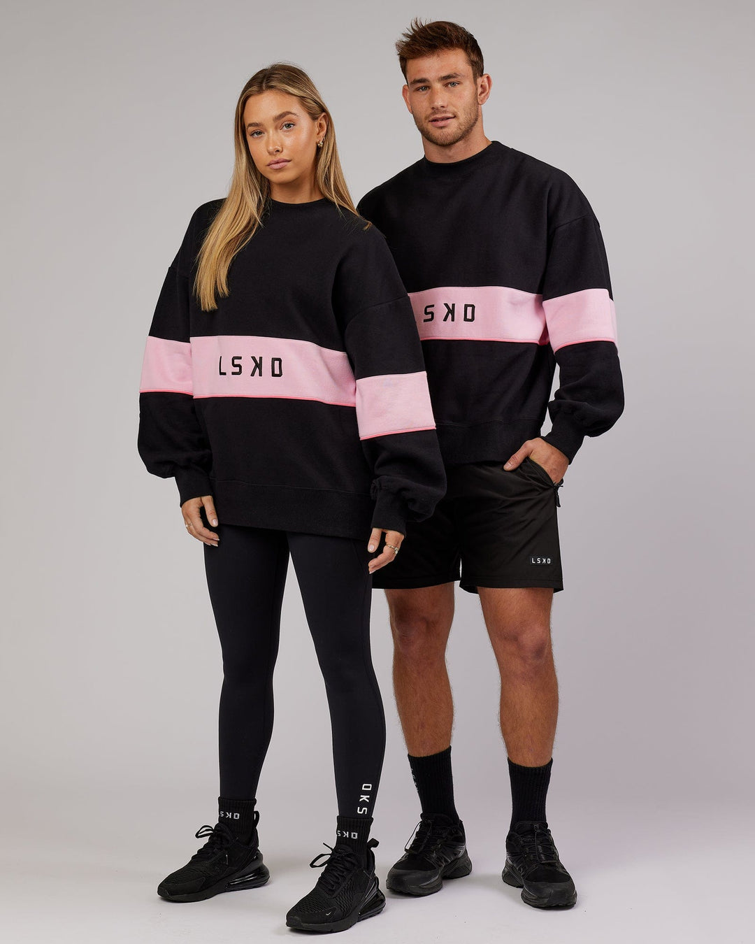 Duo wearing Unisex Extra Time Sweater Oversize - Black-Petal Pink