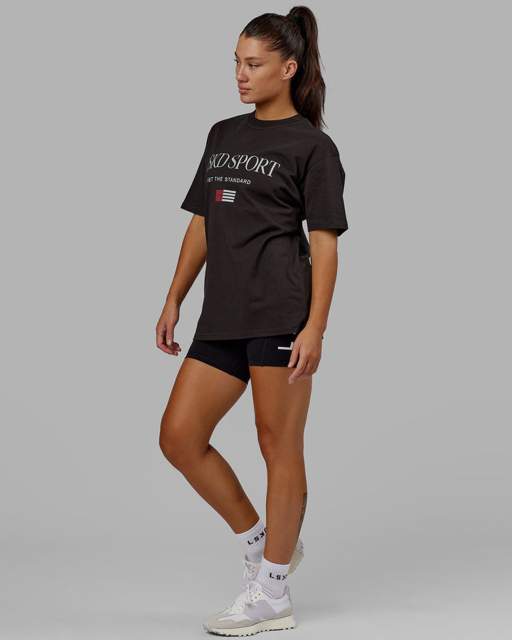 Woman wearing Unisex Flag Heavyweight Tee Oversize - Dark Walnut