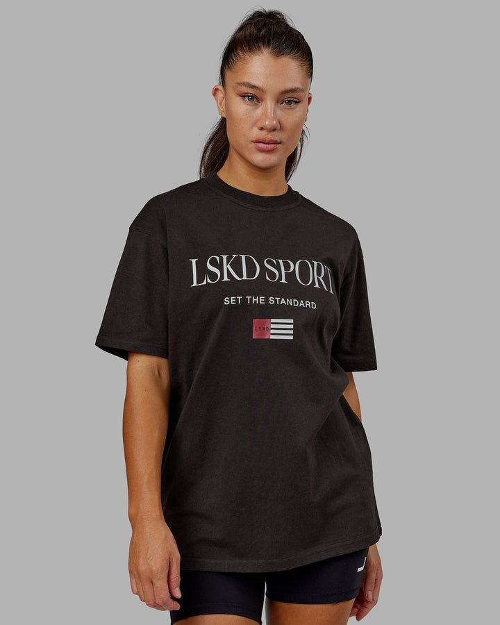 Woman wearing Unisex Flag Heavyweight Tee Oversize - Dark Walnut