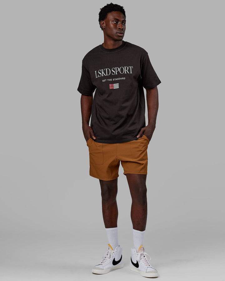 Man wearing Unisex Flag Heavyweight Tee Oversize - Dark Walnut