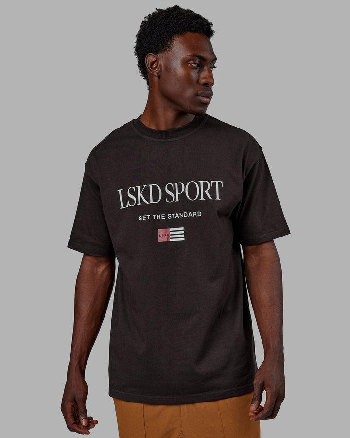 Man wearing Unisex Flag Heavyweight Tee Oversize - Dark Walnut