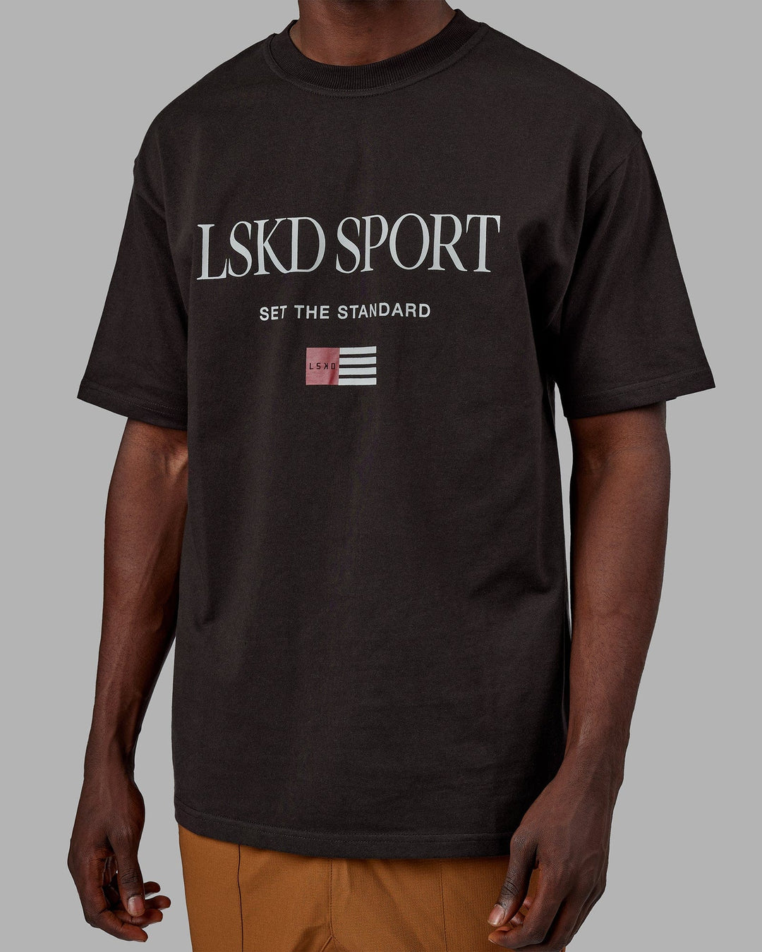 Man wearing Unisex Flag Heavyweight Tee Oversize - Dark Walnut
