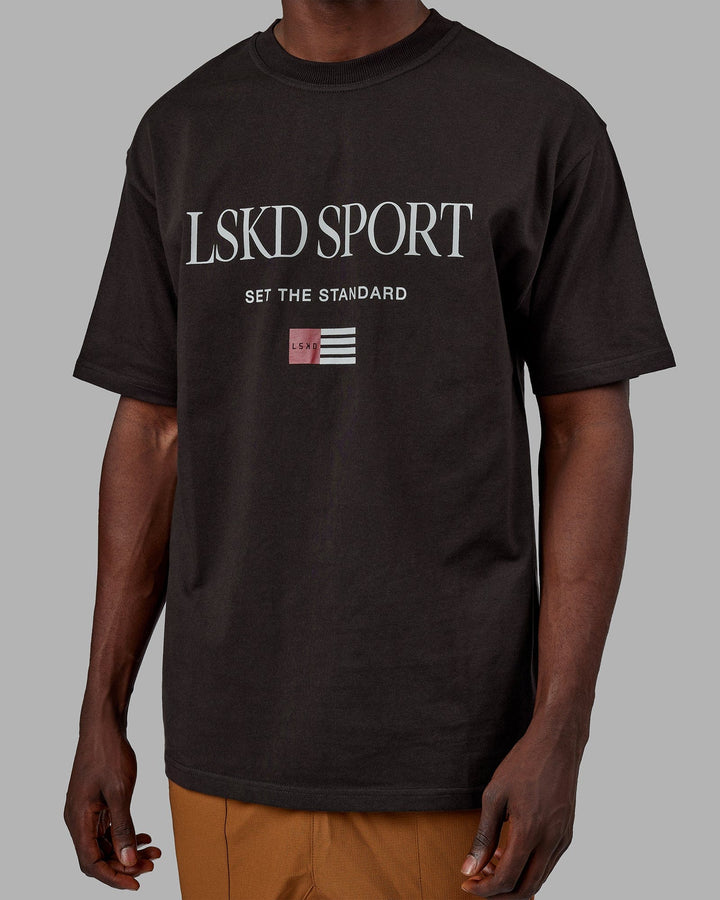 Man wearing Unisex Flag Heavyweight Tee Oversize - Dark Walnut