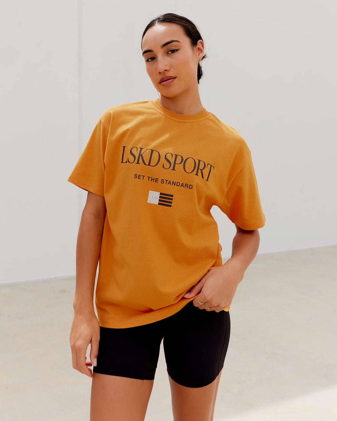 Woman wearing Unisex Flag Heavyweight Tee Oversize - Sundial