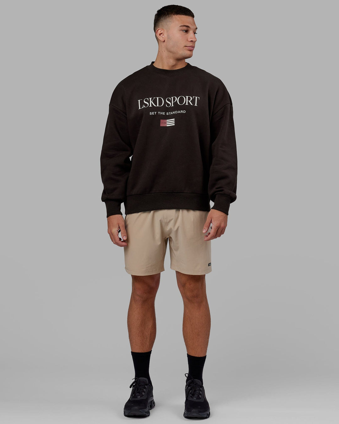Man wearing Unisex Flag Sweater Oversize - Dark Walnut