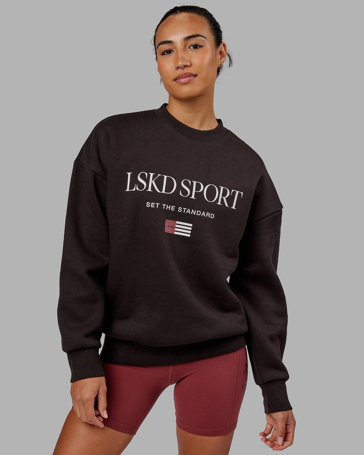 Woman wearing Unisex Flag Sweater Oversize - Dark Walnut