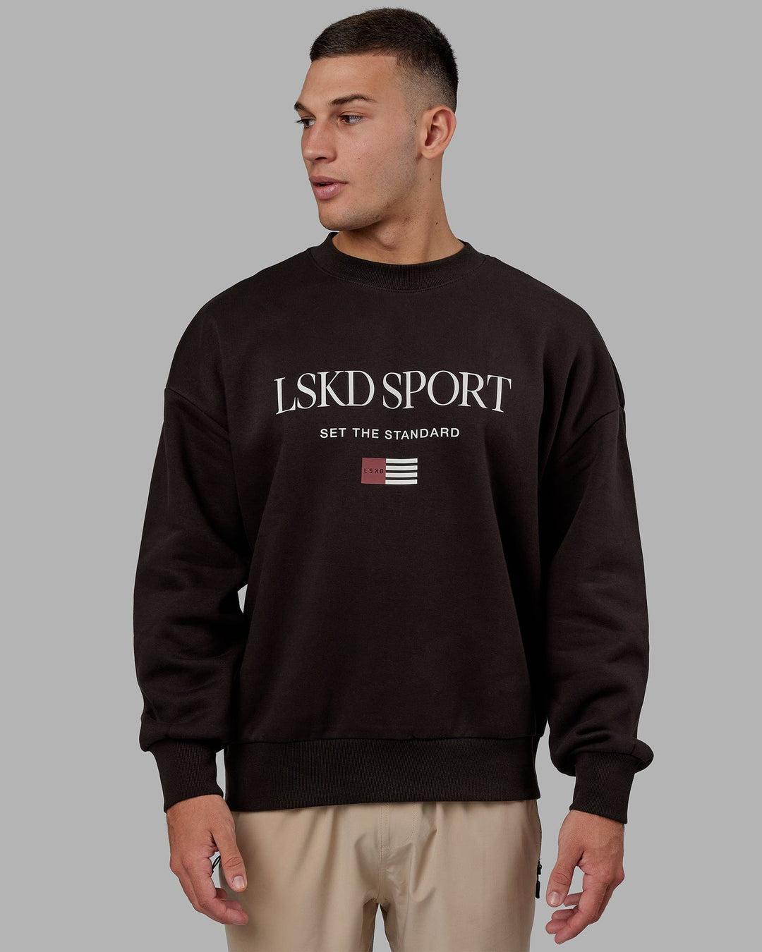Man wearing Unisex Flag Sweater Oversize - Dark Walnut