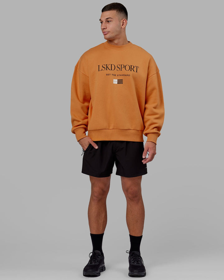 Man wearing Unisex Flag Sweater Oversize - Sundial