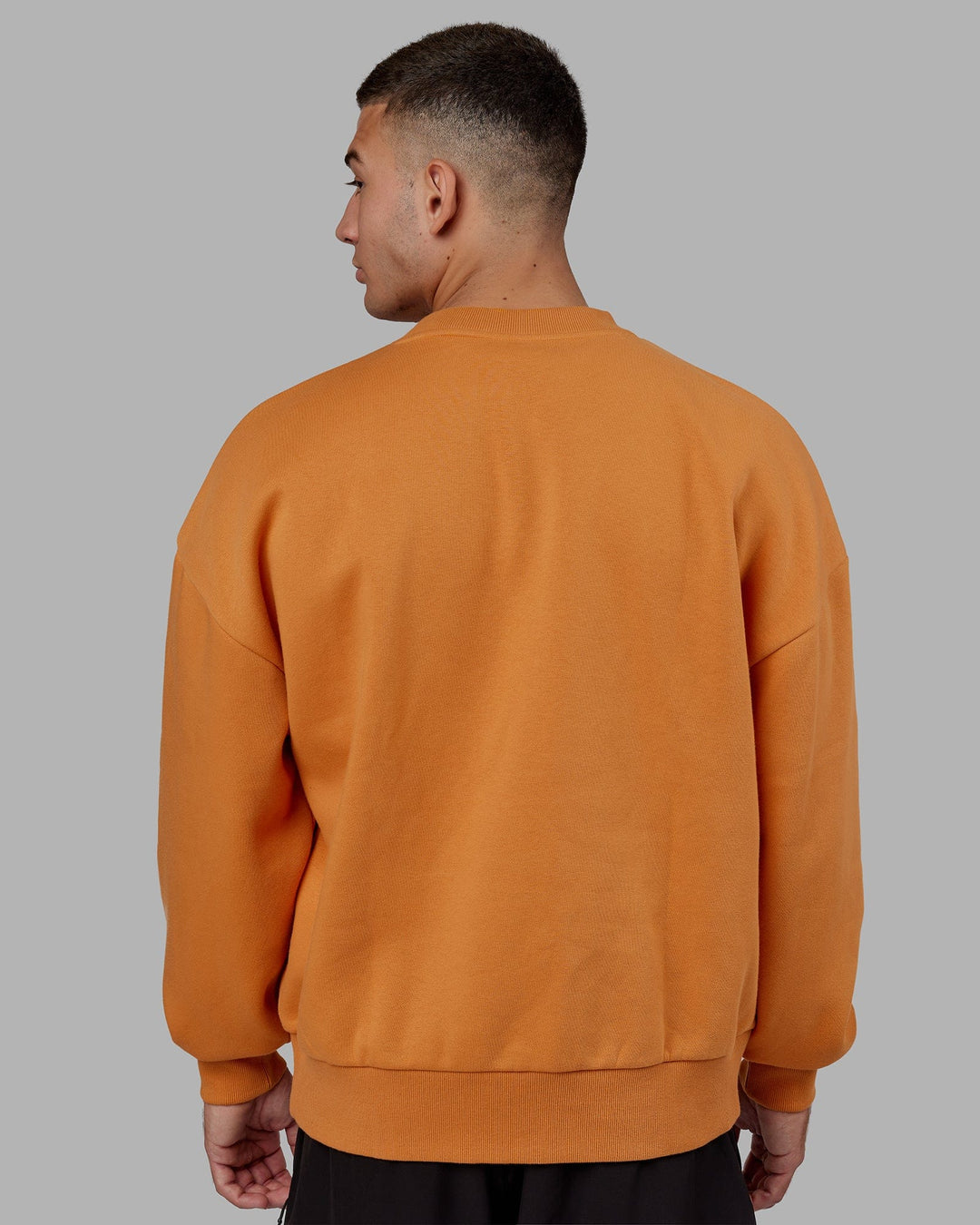Man wearing Unisex Flag Sweater Oversize - Sundial