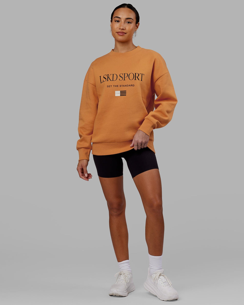 Woman wearing Unisex Flag Sweater Oversize - Sundial