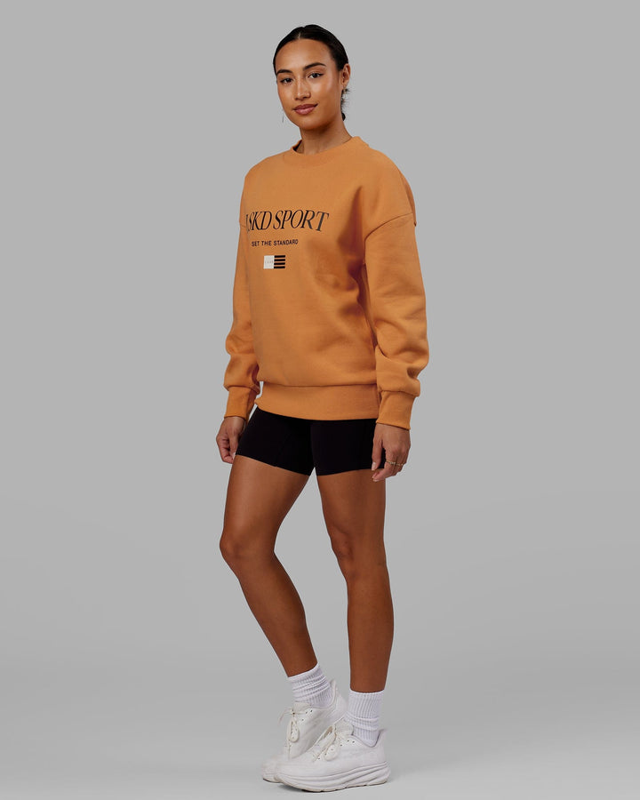 Woman wearing Unisex Flag Sweater Oversize - Sundial