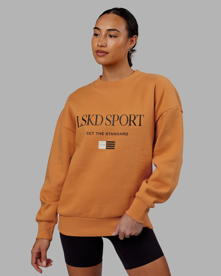 Woman wearing Unisex Flag Sweater Oversize - Sundial
