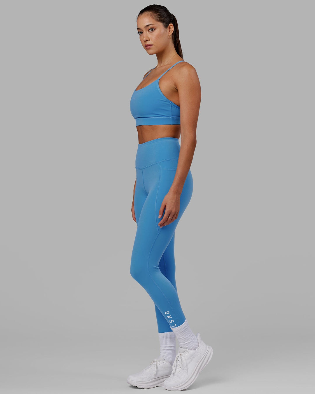 Woman wearing Flux 7/8 Length Tight - Azure Blue