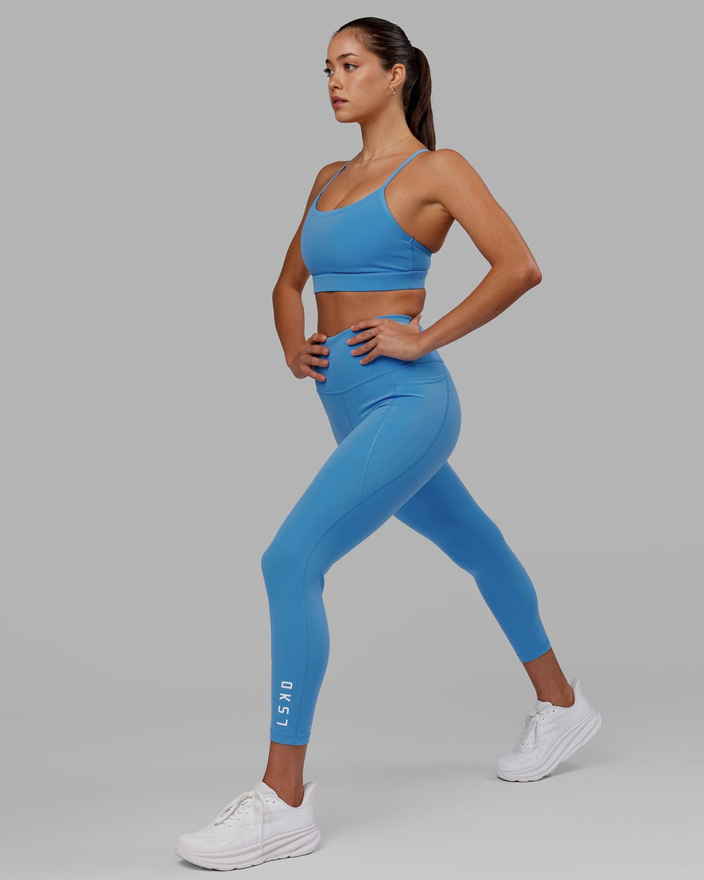 Woman wearing Flux 7/8 Length Tight - Azure Blue