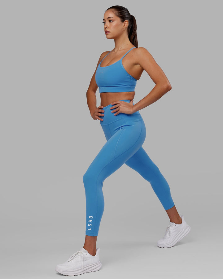 Woman wearing Flux 7/8 Length Tight - Azure Blue