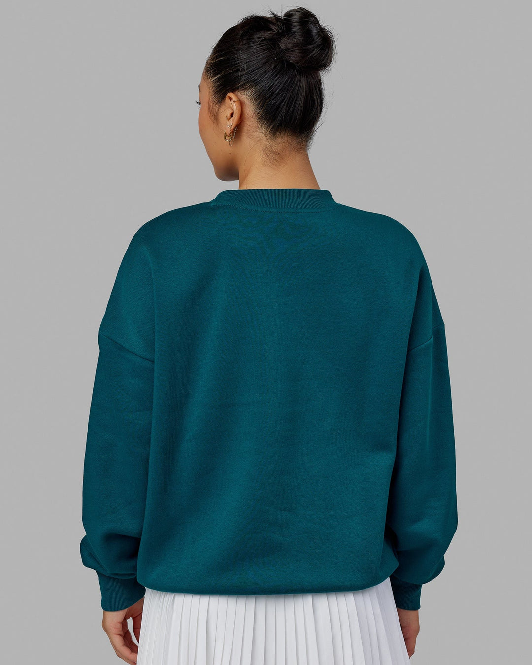 Woman wearing Unisex Free Throw Sweater Oversize - Deep Lagoon