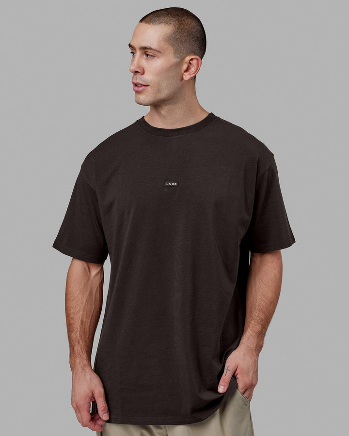Man wearing Fundamental FLXCotton Tee Longline Oversize - Dark Walnut