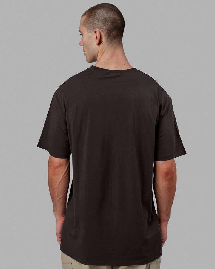 Man wearing Fundamental FLXCotton Tee Longline Oversize - Dark Walnut
