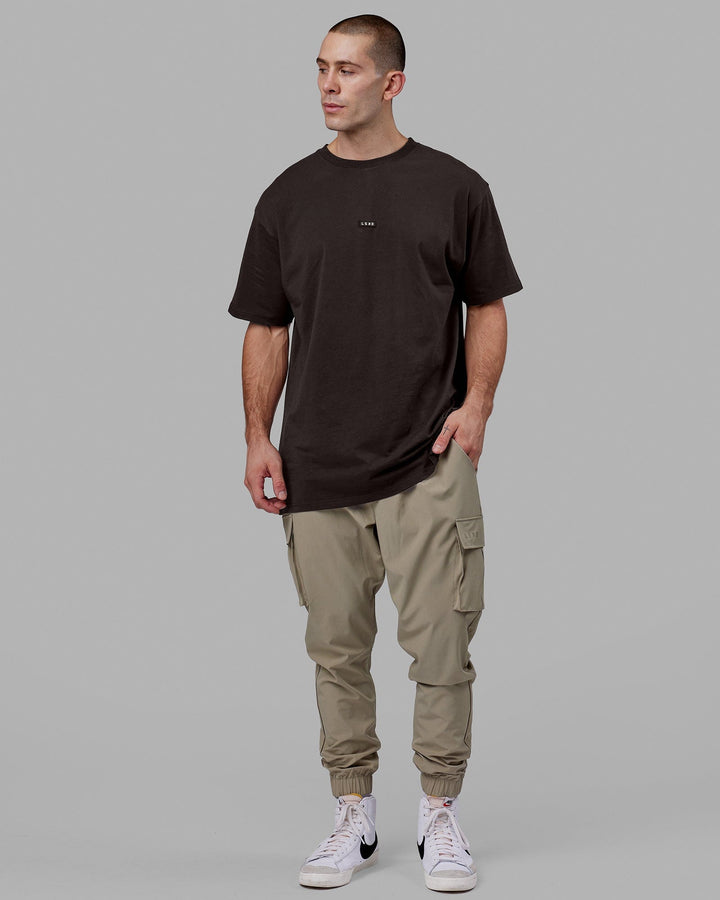 Man wearing Fundamental FLXCotton Tee Longline Oversize - Dark Walnut