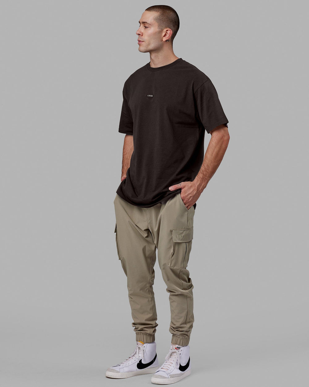 Man wearing Fundamental FLXCotton Tee Longline Oversize - Dark Walnut
