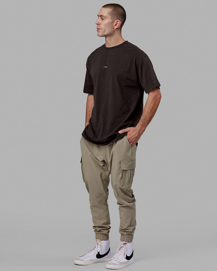Man wearing Fundamental FLXCotton Tee Longline Oversize - Dark Walnut