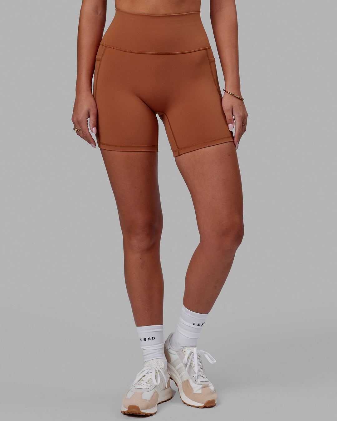 Woman wearing Fusion Ultra High-Rise 6&quot; Short Pockets - Hazel | Model:Milly | Size:S