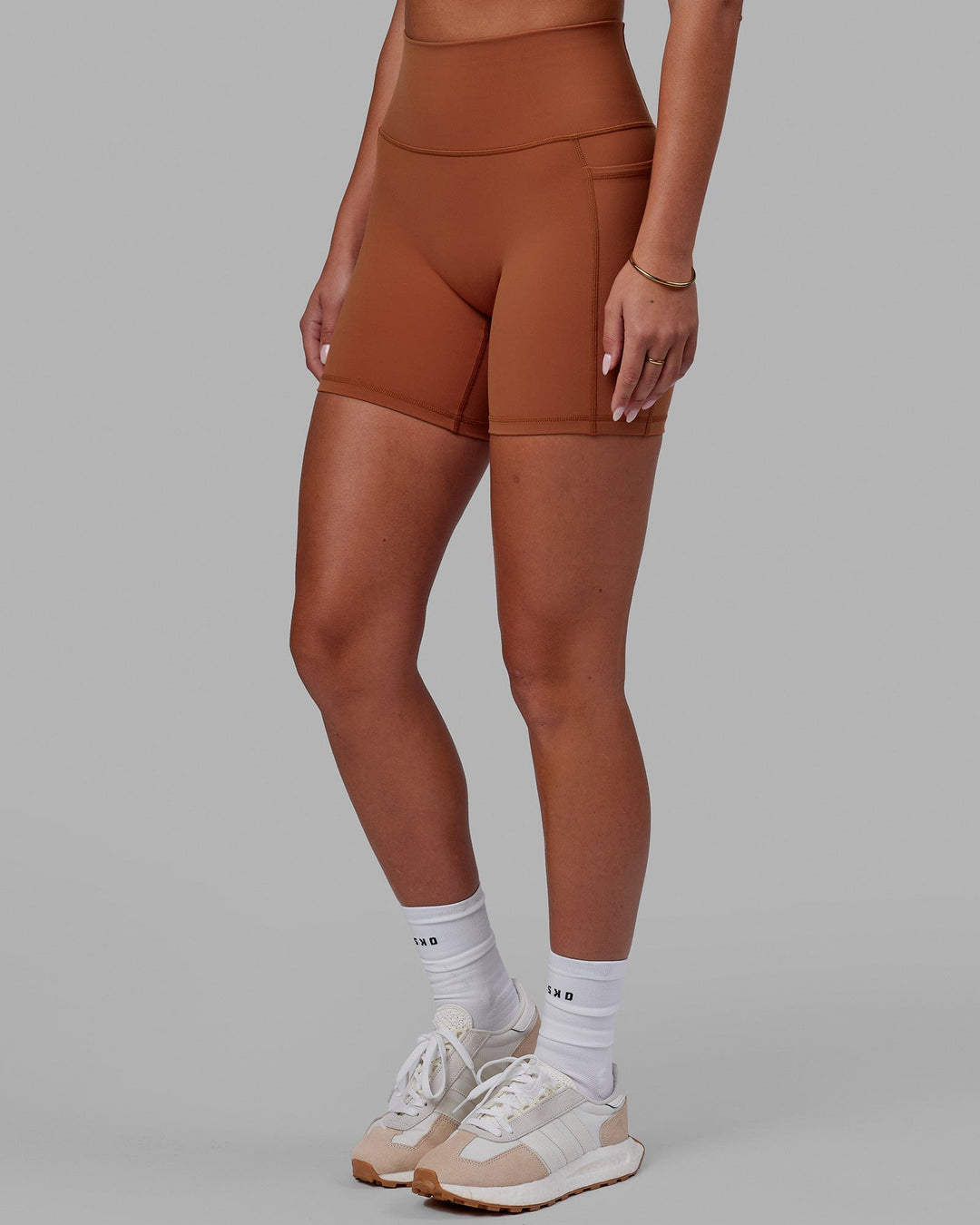 Woman wearing Fusion Ultra High-Rise 6&quot; Short Pockets - Hazel | Model:Milly | Size:S