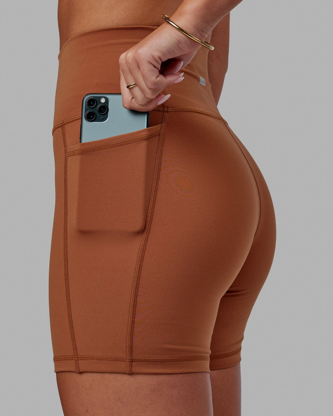 Woman wearing Fusion Ultra High-Rise 6&quot; Short Pockets - Hazel | Model:Milly | Size:S