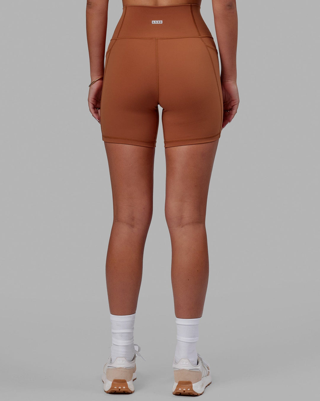 Woman wearing Fusion Ultra High-Rise 6&quot; Short Pockets - Hazel | Model:Milly | Size:S