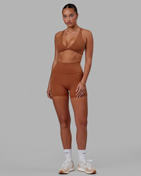 Woman wearing Fusion Ultra High-Rise 4" Short Pockets - Hazel | Model:Milly | Size:S