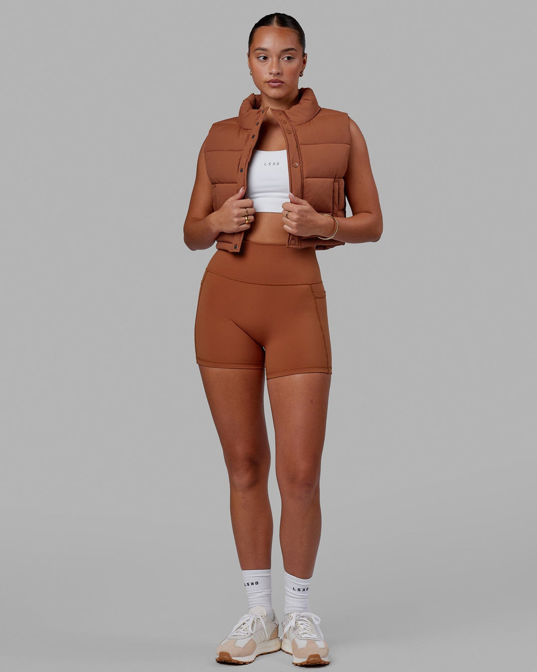 Woman wearing Fusion Ultra High-Rise 4" Short Pockets - Hazel | Model:Milly | Size:S