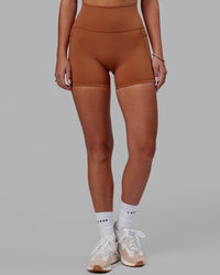 Woman wearing Fusion Ultra High-Rise 4" Short Pockets - Hazel | Model:Milly | Size:S