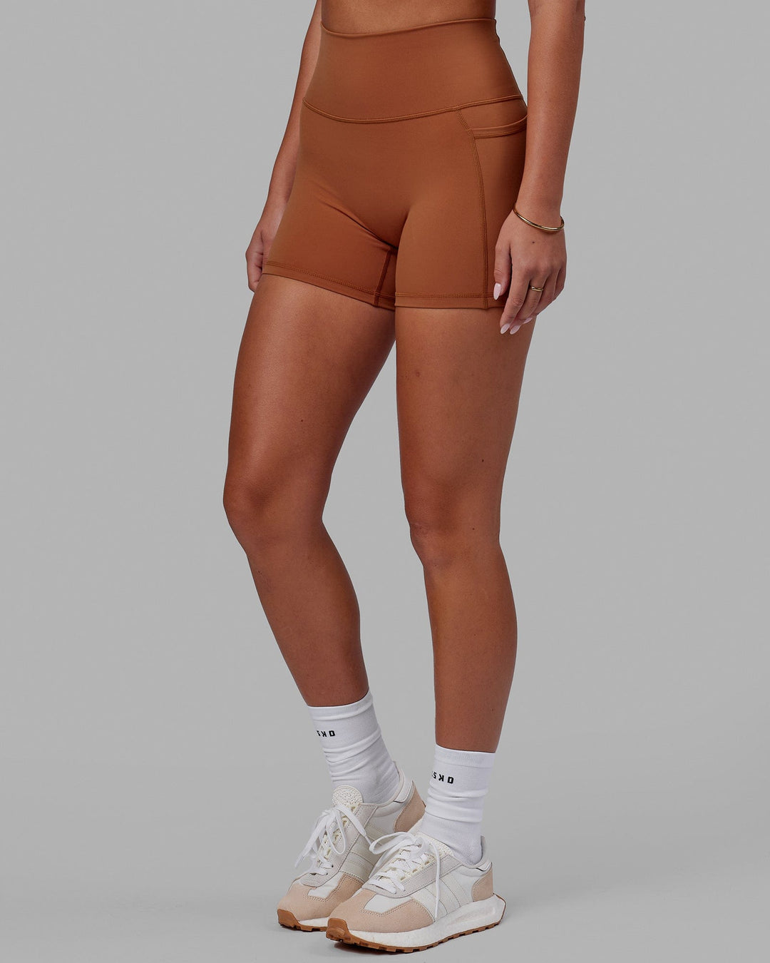 Woman wearing Fusion Ultra High-Rise 4" Short Pockets - Hazel | Model:Milly | Size:S