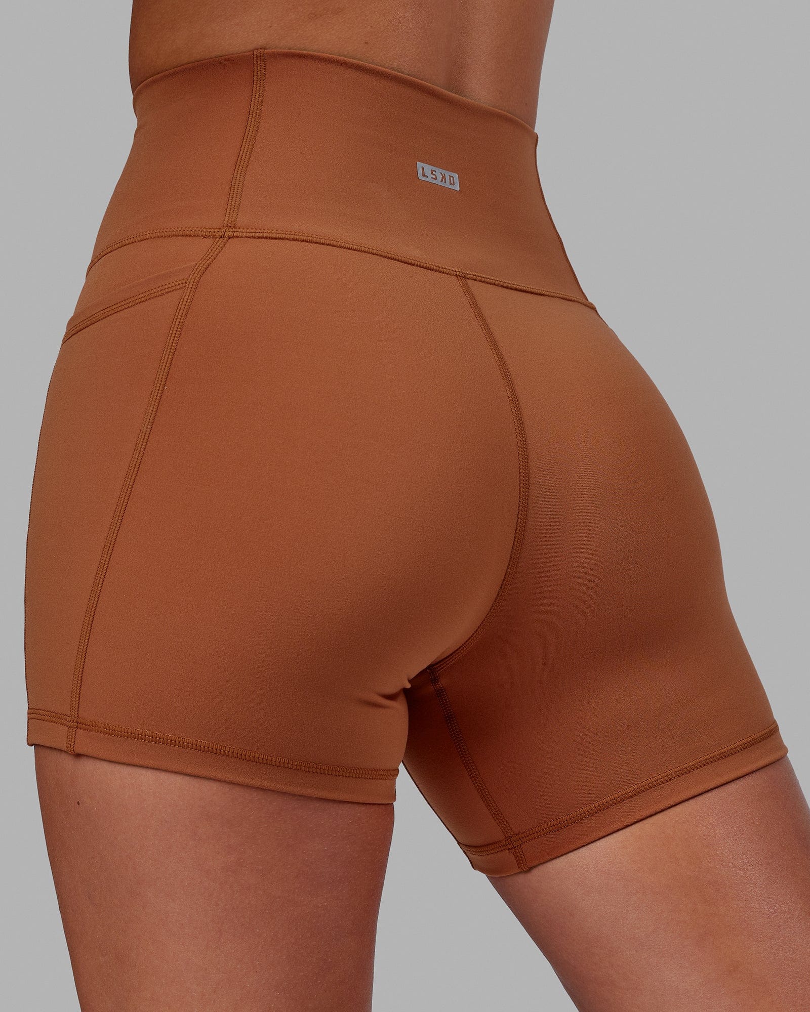 Woman wearing Fusion Ultra High-Rise 4" Short Pockets - Hazel | Model:Milly | Size:S
