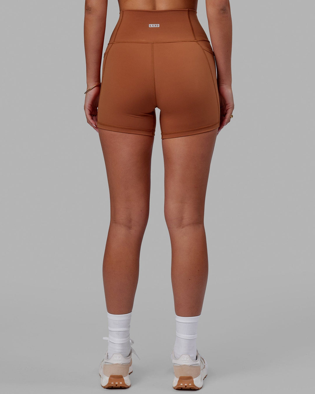 Woman wearing Fusion Ultra High-Rise 4" Short Pockets - Hazel | Model:Milly | Size:S
