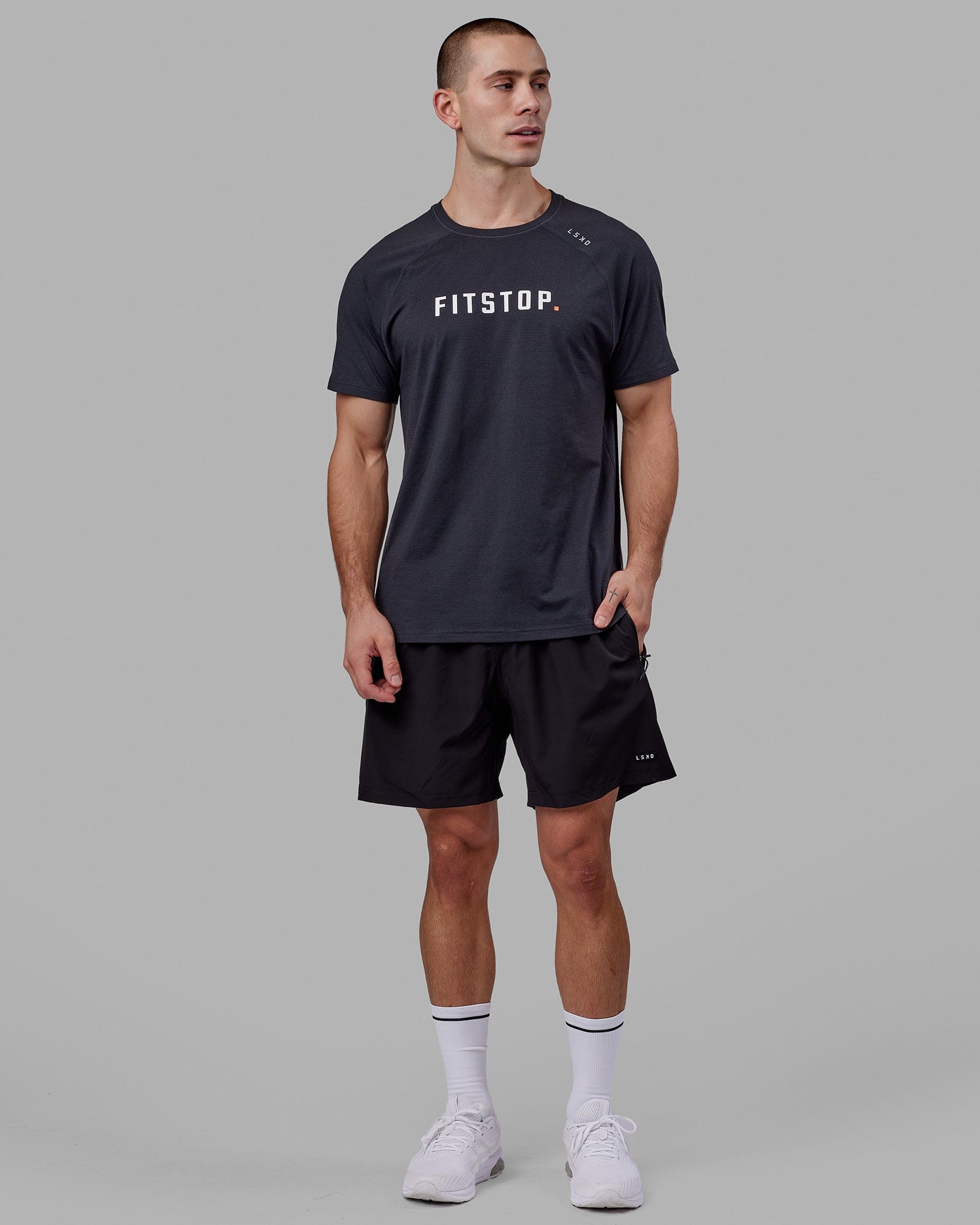 Man wearing LSKD x FS VapourFLX Trainer Tee - Black Marl