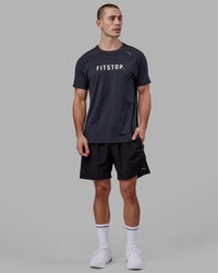 Man wearing LSKD x FS VapourFLX Trainer Tee - Black Marl